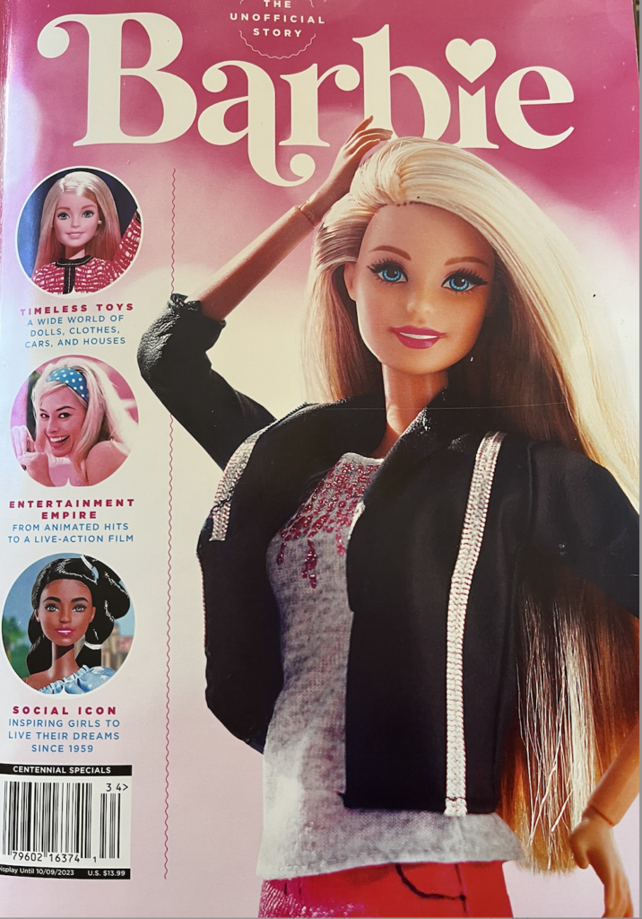 Photo of Pink magazine titled the Unofficial Story of Barbie. Blonde Barbie on front with three smaller pictures of Barbies